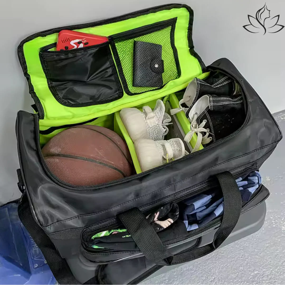 Black duffel bag with green interior compartment containing a basketball, sports equipment, and clothing.
