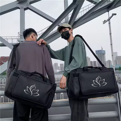 Two people carrying black bags with a white logo on a cityscape background